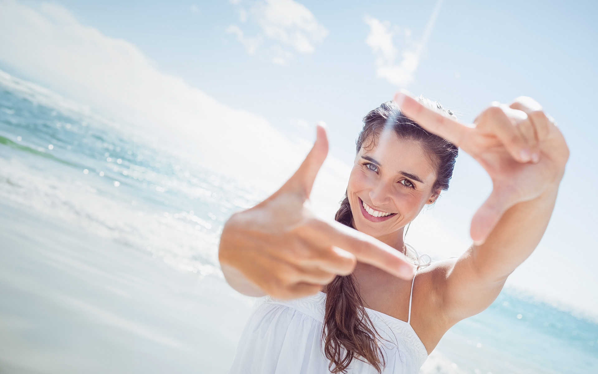 A modern dental practice with a blue and white chair, a dental treatment table, and medical equipment.